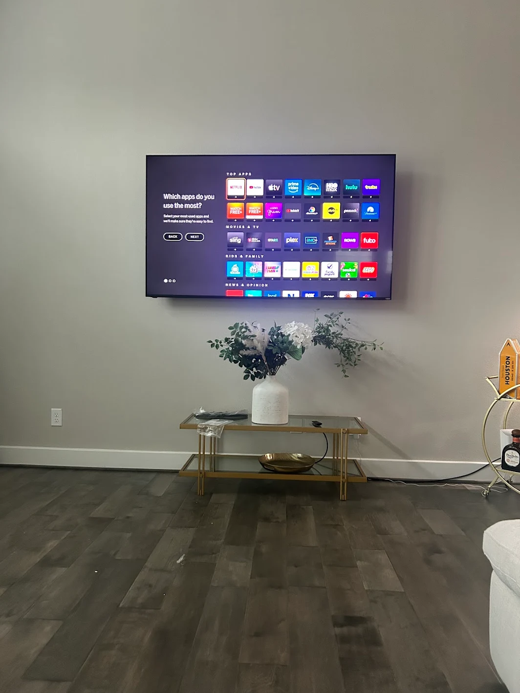 Living room TV mounted above a console in Houston