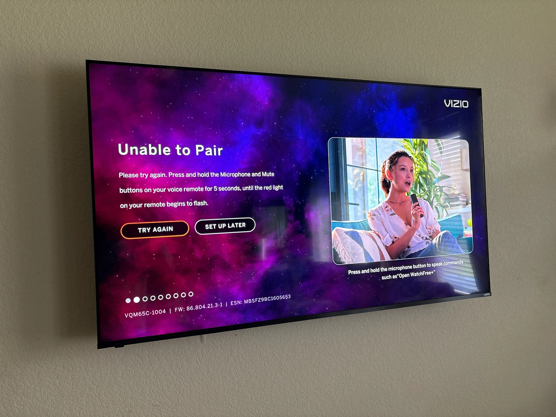 Large Vizio TV mounted flush on a textured wall